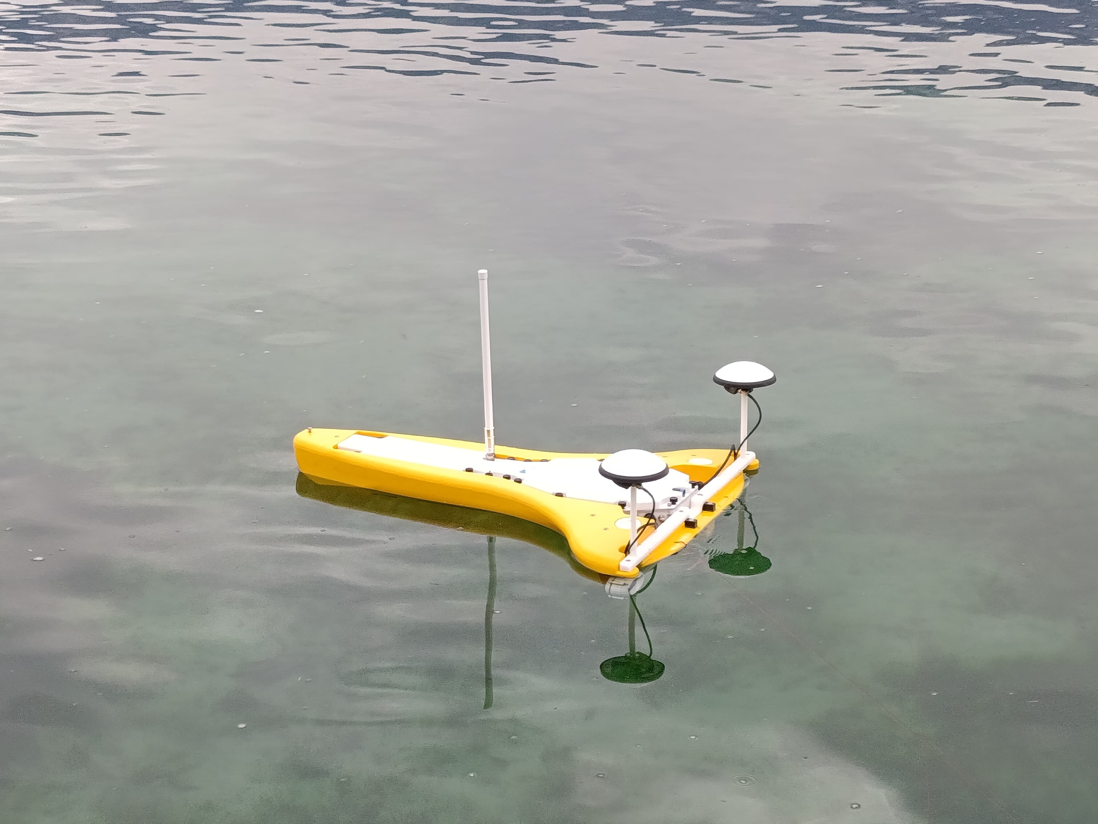USV floating on calm water, seen from above